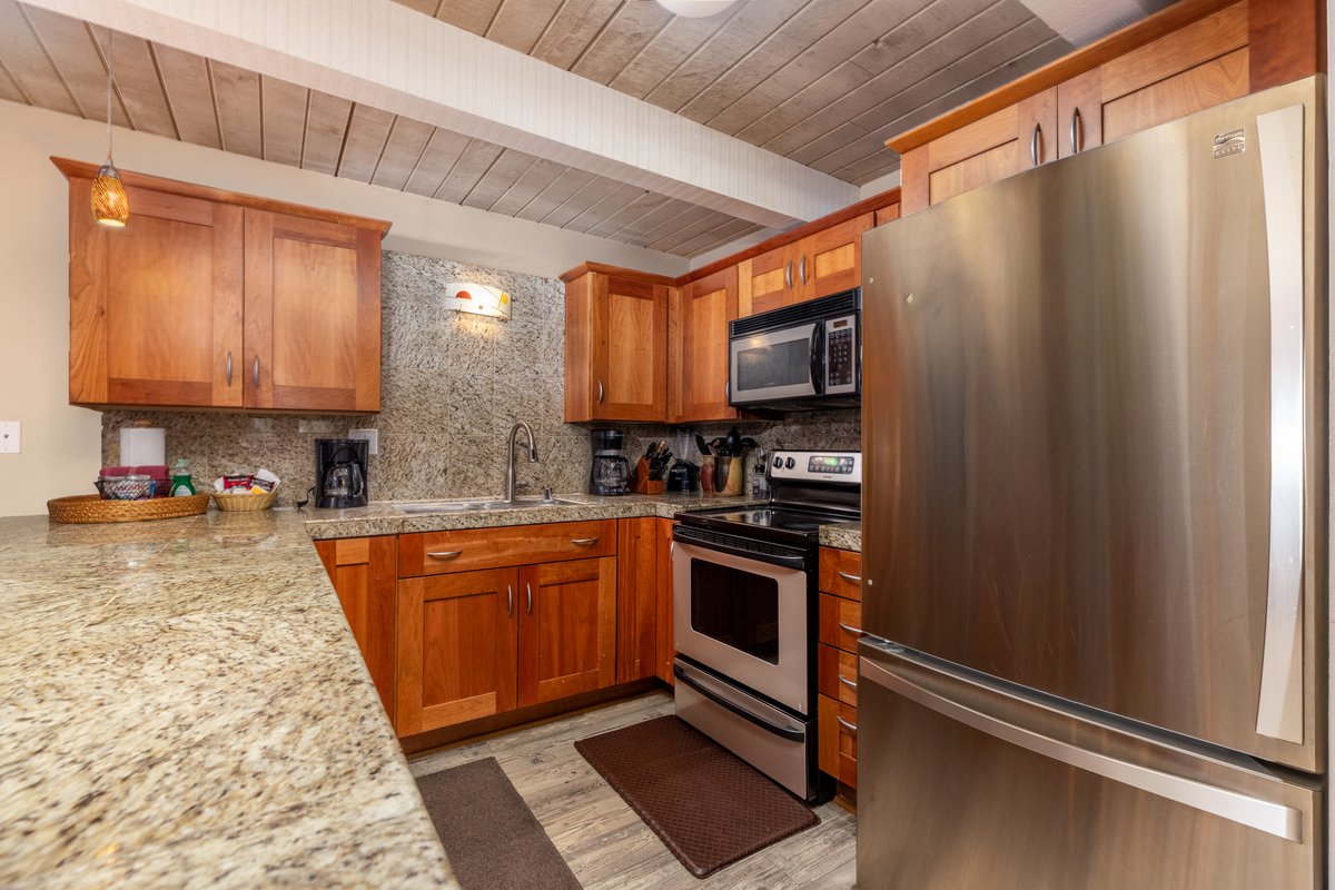 Open kitchen with stone fireplace
