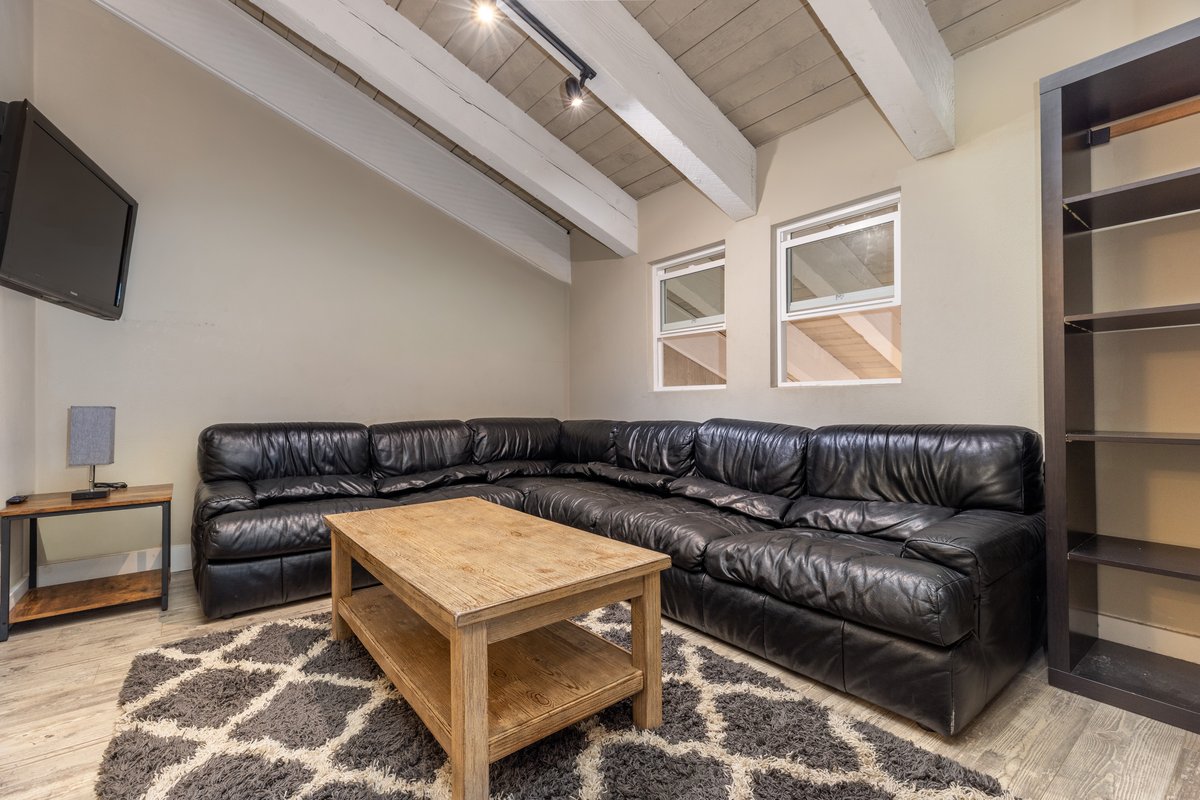 Living room with loft above